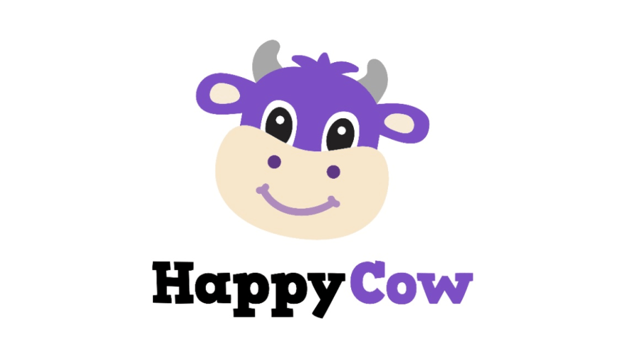 Illustration einer lächelnden Kuh mit dem Schriftzug "HappyCow"